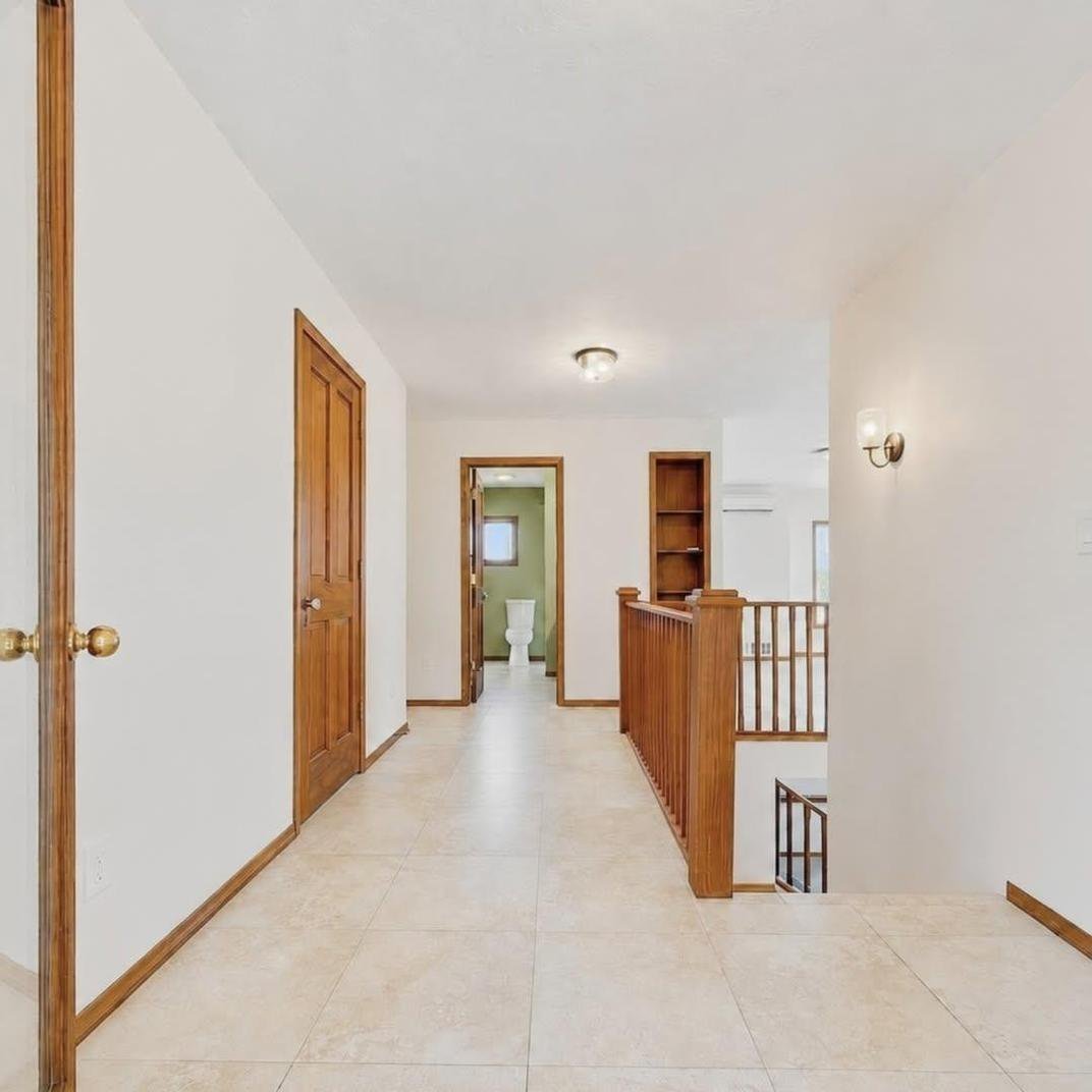 Open entry and hallway with fresh white walls