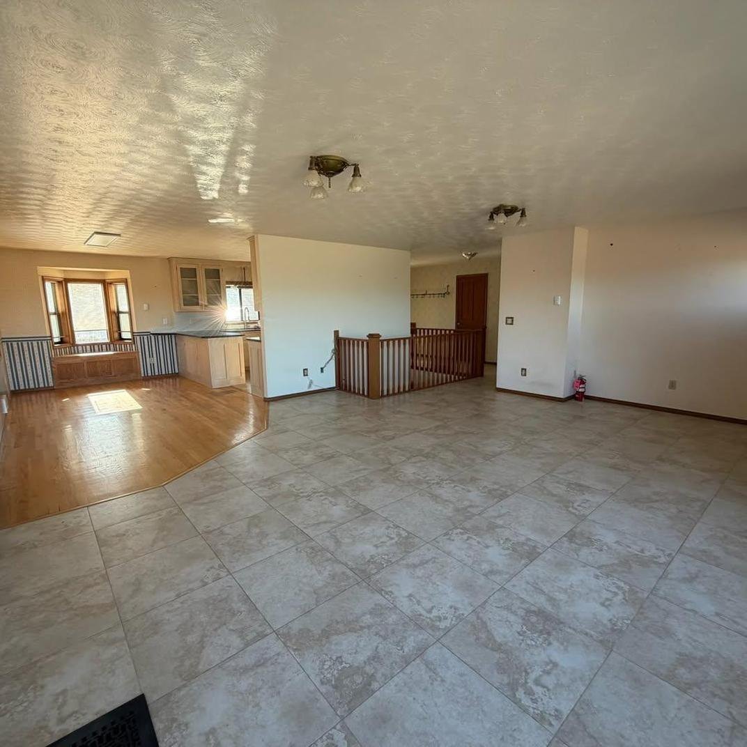Open living space cleared for flooring work