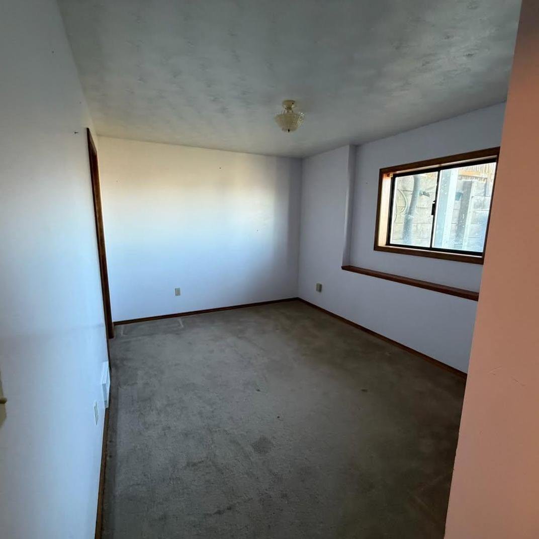 Bedroom cleared and prepped for paint
